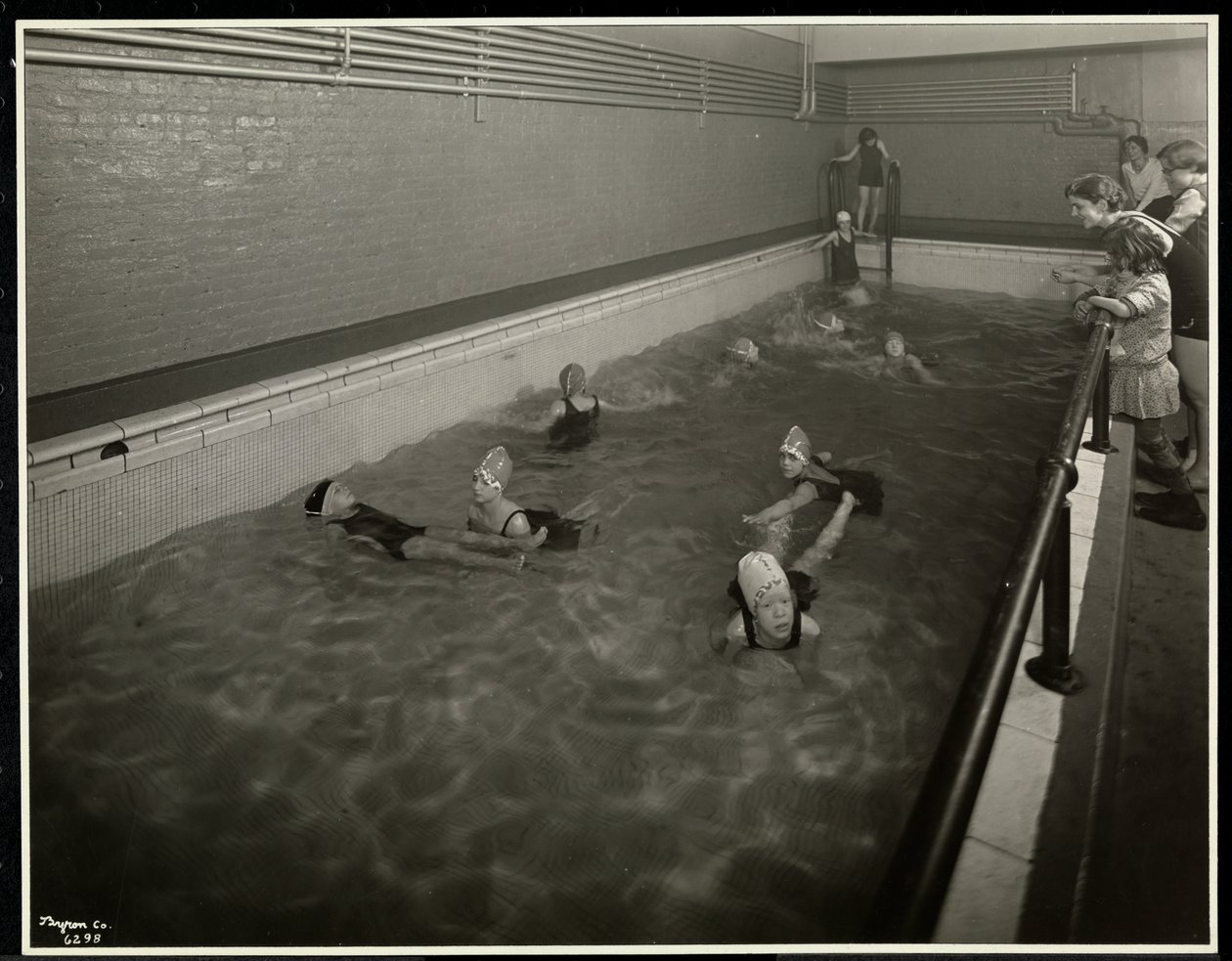 Girls swimming at the New York Association for the Blind, 111 East 59th Street, New York, 1930 by Byron Company