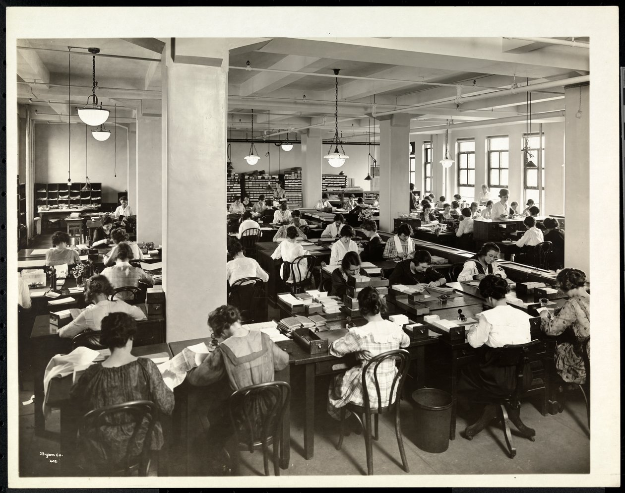 Interior view of women working in the order department at International Magazine Co., 119 West 40th Street, New York by Byron Company