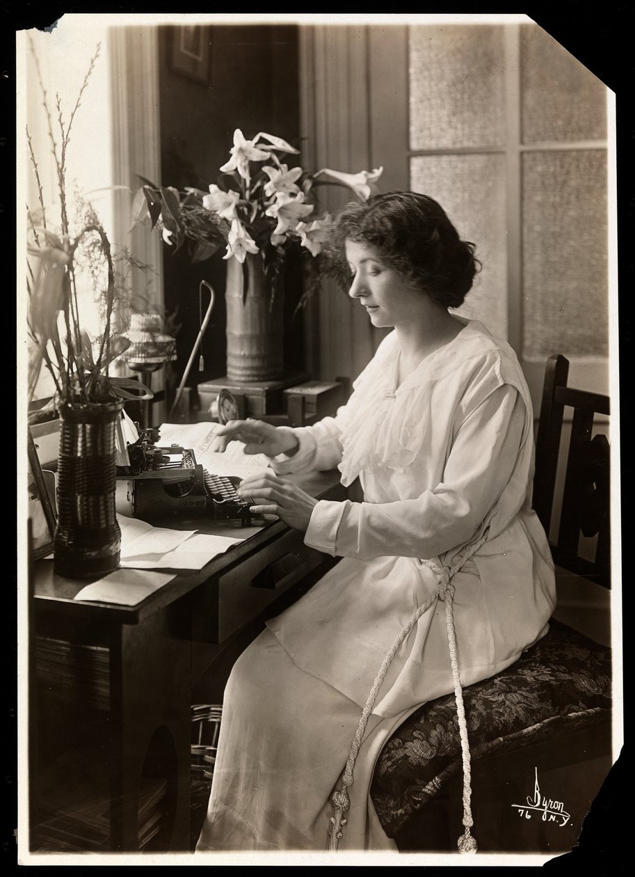 Maude Fealy seated at a typewriter, c.1915 by Byron Company