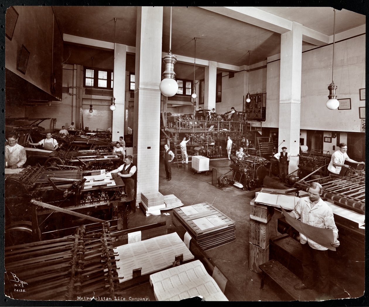 Men working in the printing plant at Metropolitan Life Insurance Co. at 23rd Street and Madison Avenue, New York by Byron Company