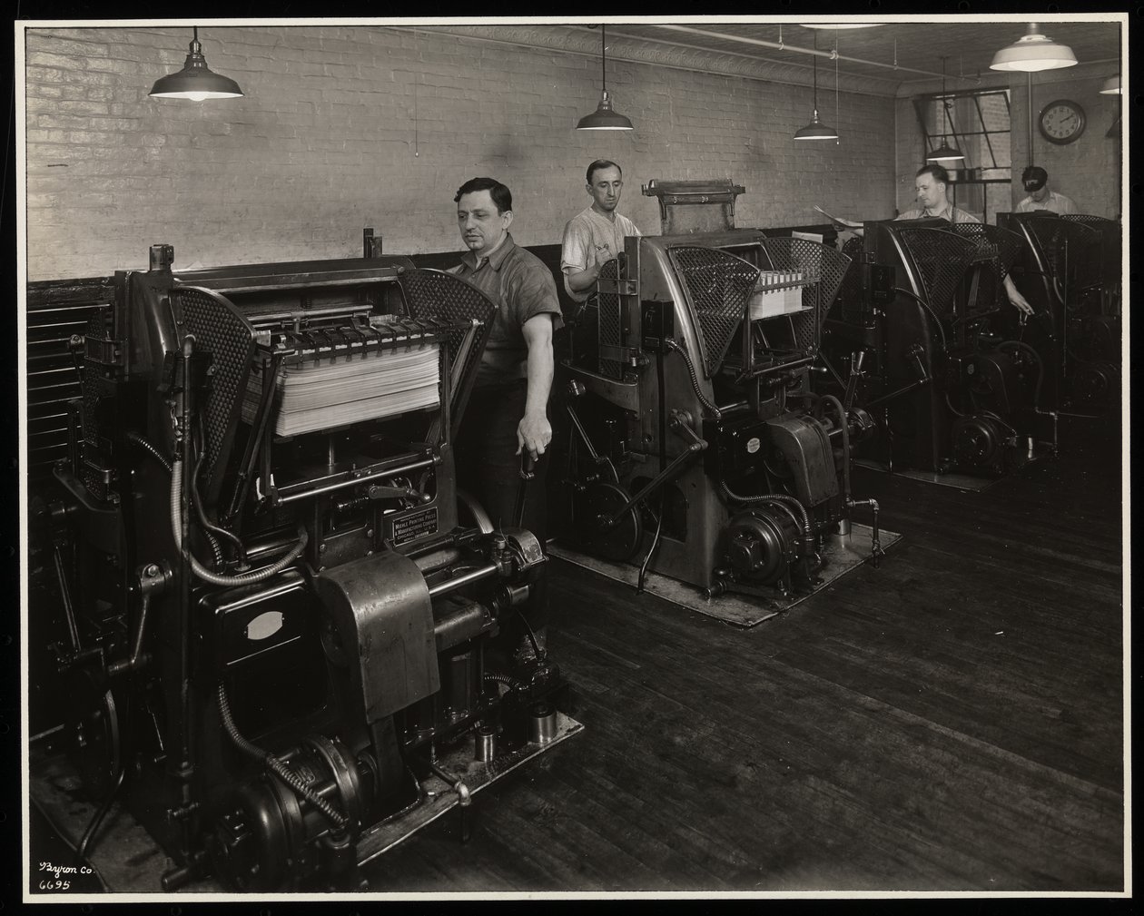 Men Working Printing Presses at Unz und Co., 24 Beaver Street, New York, 1932 by Byron Company