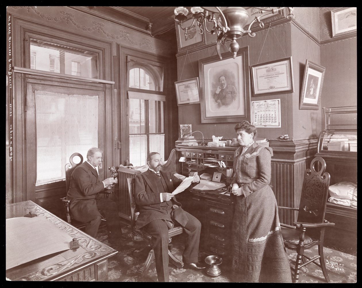 Mr. and Mrs. Maillard and Mr. Davitt in an Office of Maillard