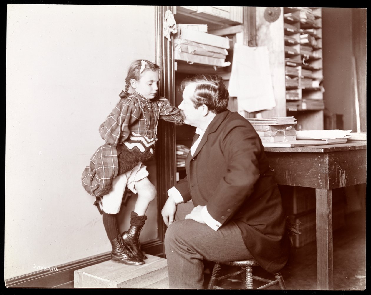 Professor Atkinson, an English Bone Setter, with a Young Female Patient by Byron Company