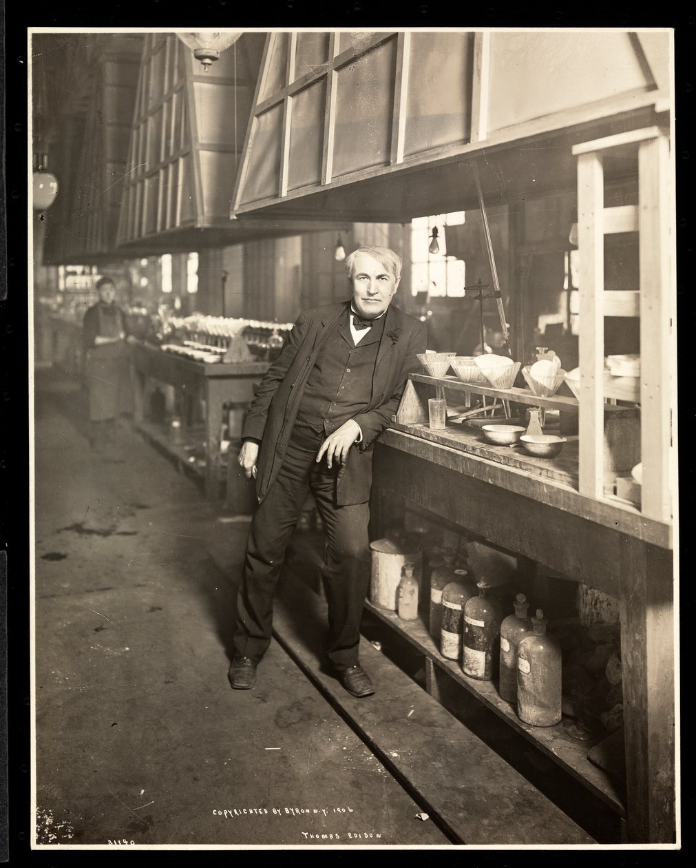 Thomas Edison in his laboratory by Byron Company