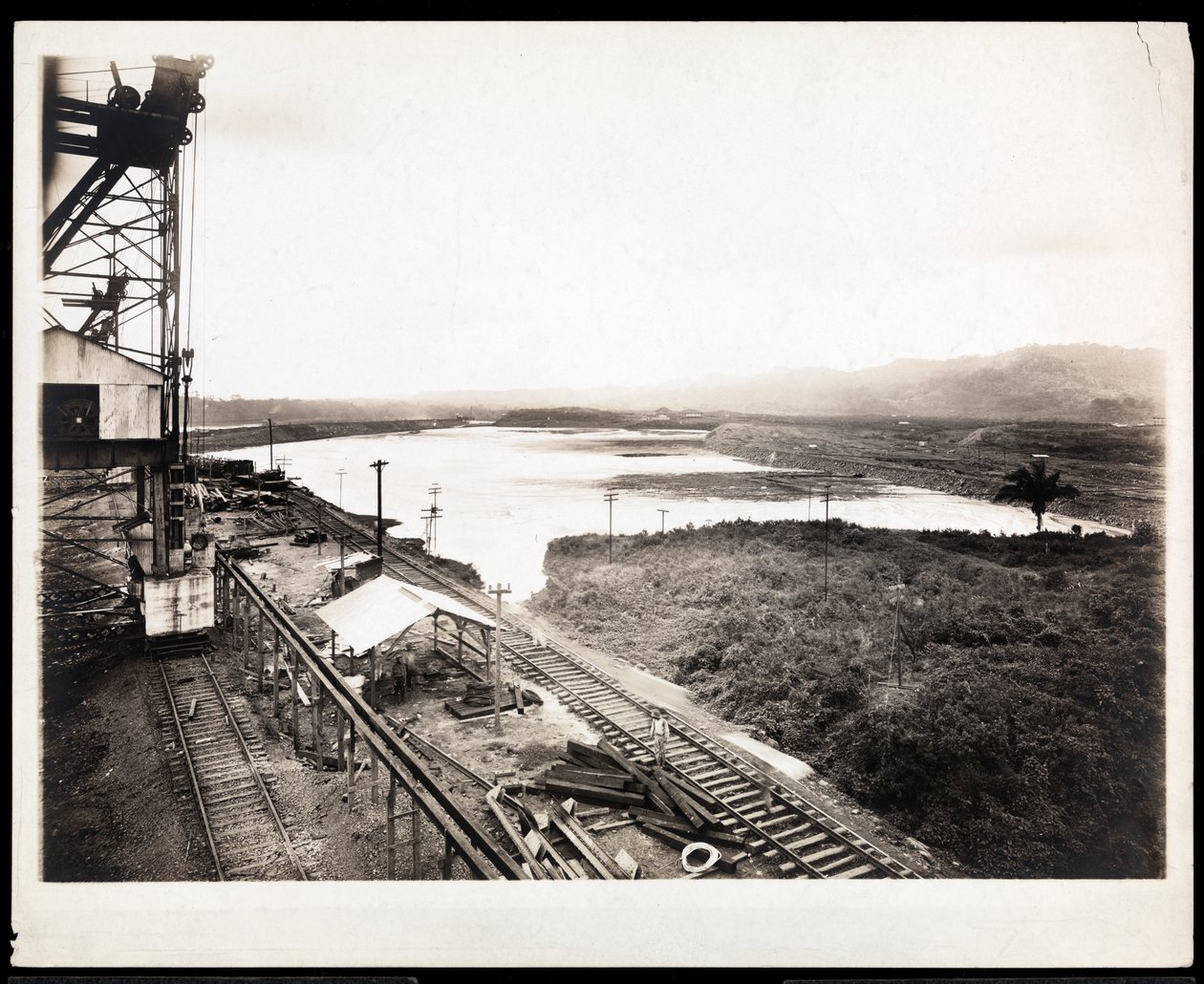 View of railroad tracks and machinery at the construction of the Panama Canal, 1912 or 1913 by Byron Company