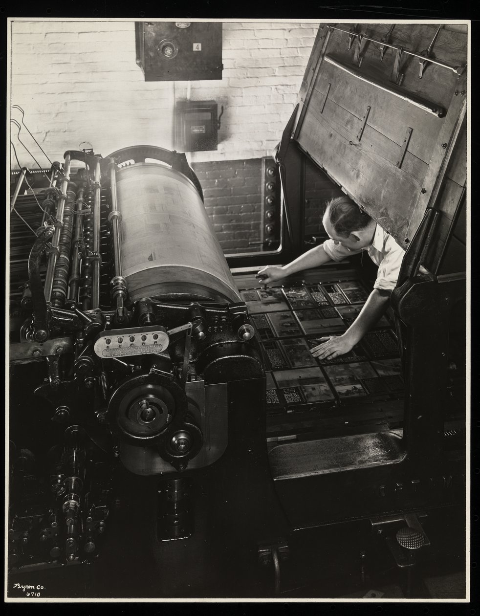 Working at a Meihle press at Unz and Co., 24 Beaver Street, New York, 1932 by Byron Company