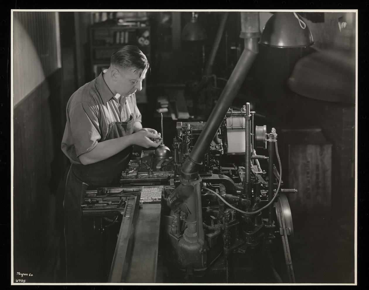 Working on a Monotype Machine at Unz and Co., 24 Beaver Street, New York by Byron Company