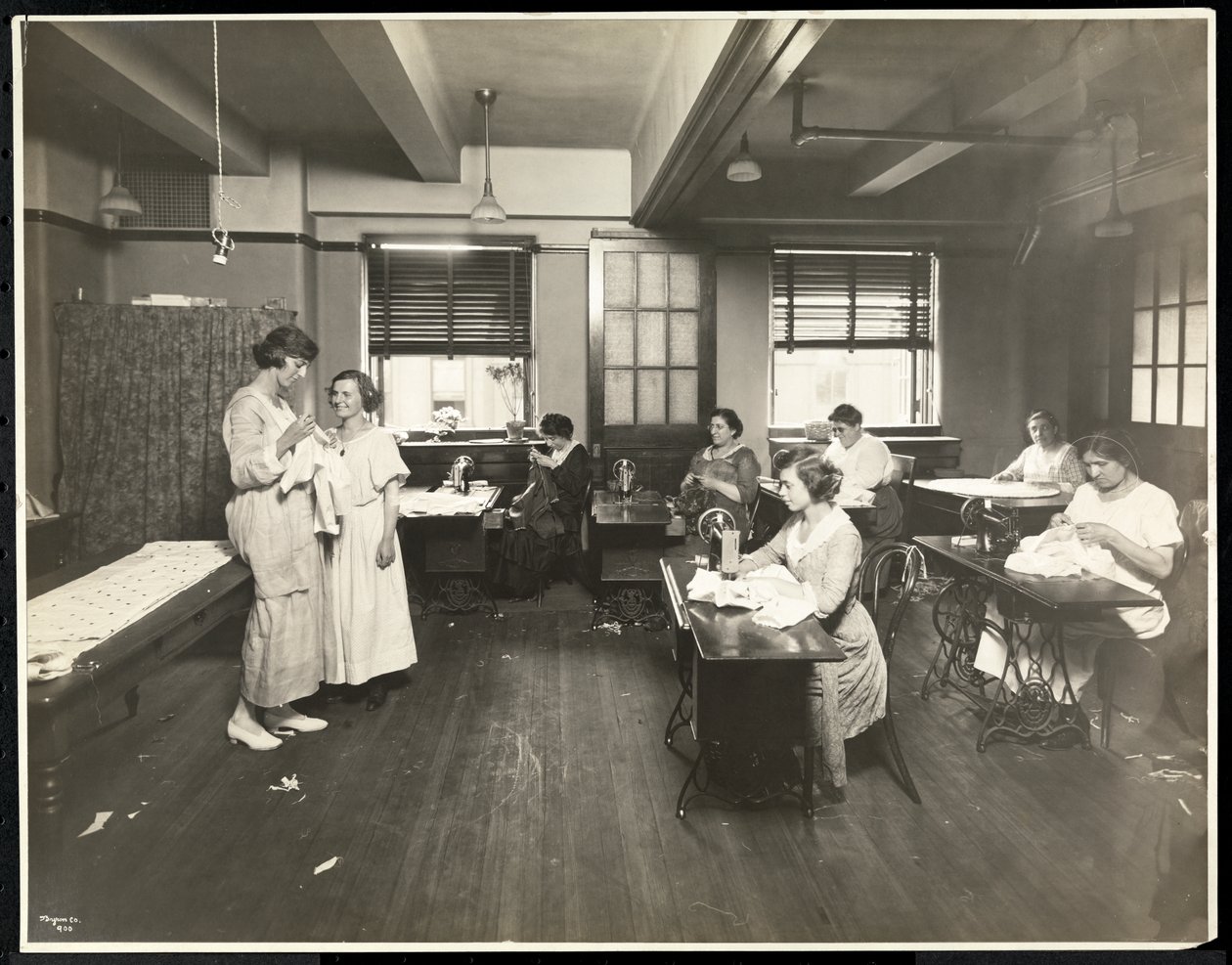 Blind young women and a teacher sewing in a classroom at the New York Association for the Blind, 111 East 59th Street, New York, 1921 by Byron Company