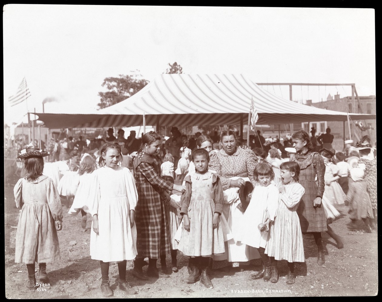 Group of girls and a woman at the Hudson Bank Gymnasium and Playground, 53rd Street and 11th Avenue, New York, 1898 by Byron Company