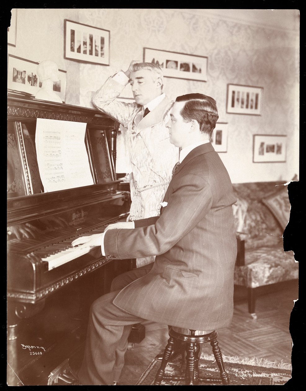 Kyrle Bellew and friend at the piano in Bellew