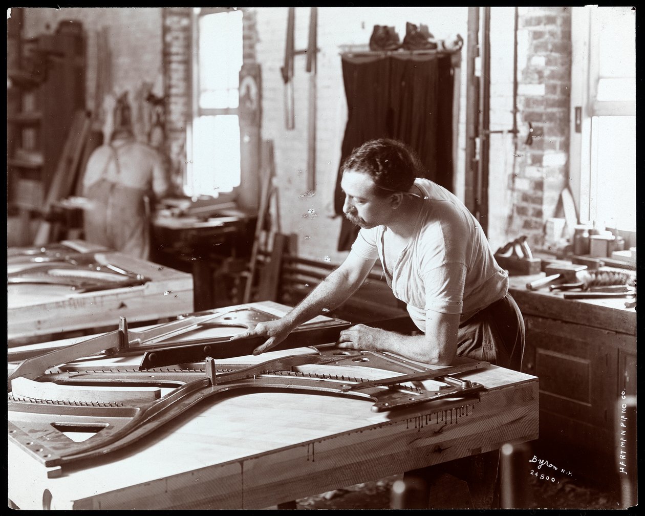 Man working in the Hardman, Peck und Co. piano factory, New York by Byron Company