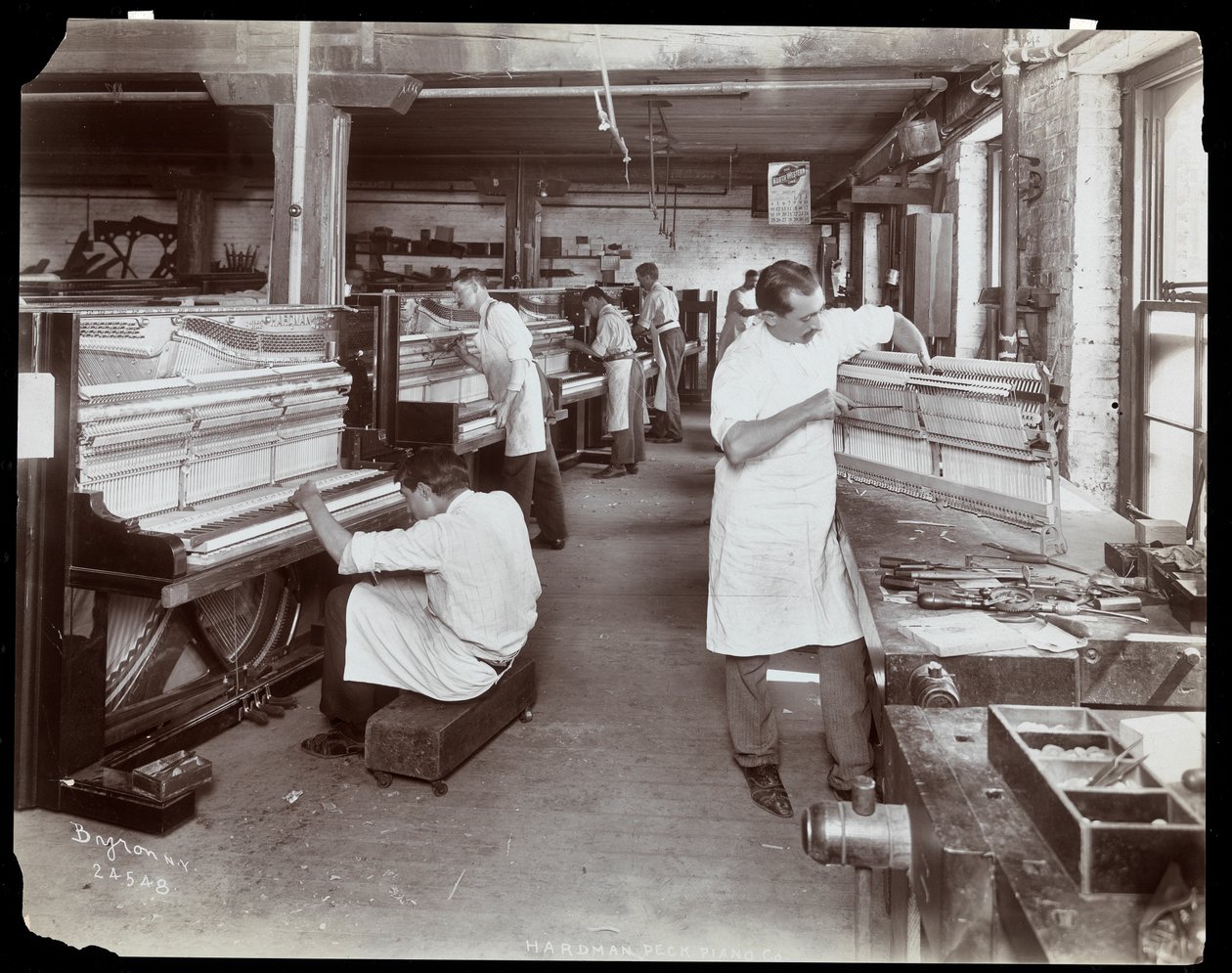 Men Working in the Hardman, Peck and Co. Piano Factory, New York, 1907 by Byron Company