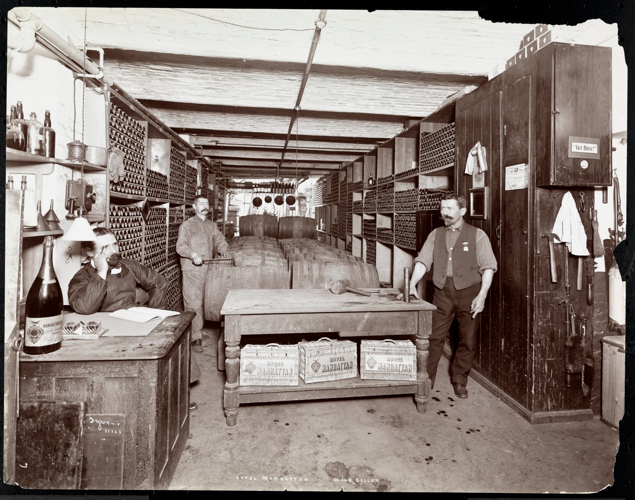 The Wine Cellar of the Hotel Manhattan, 1902 by Byron Company
