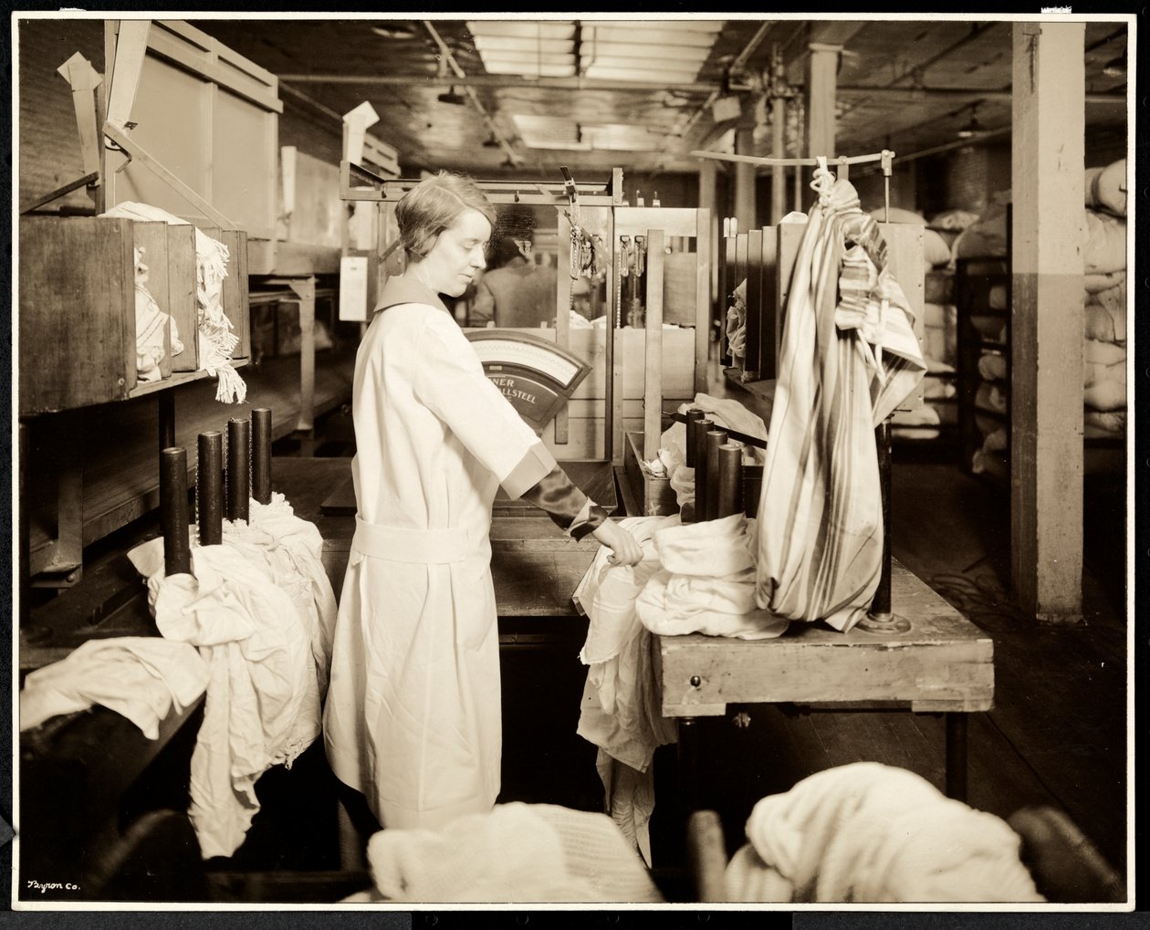 Women tagging bags of laundry at the Carolyn Laundry, East Harlem, New York, 1928 by Byron Company