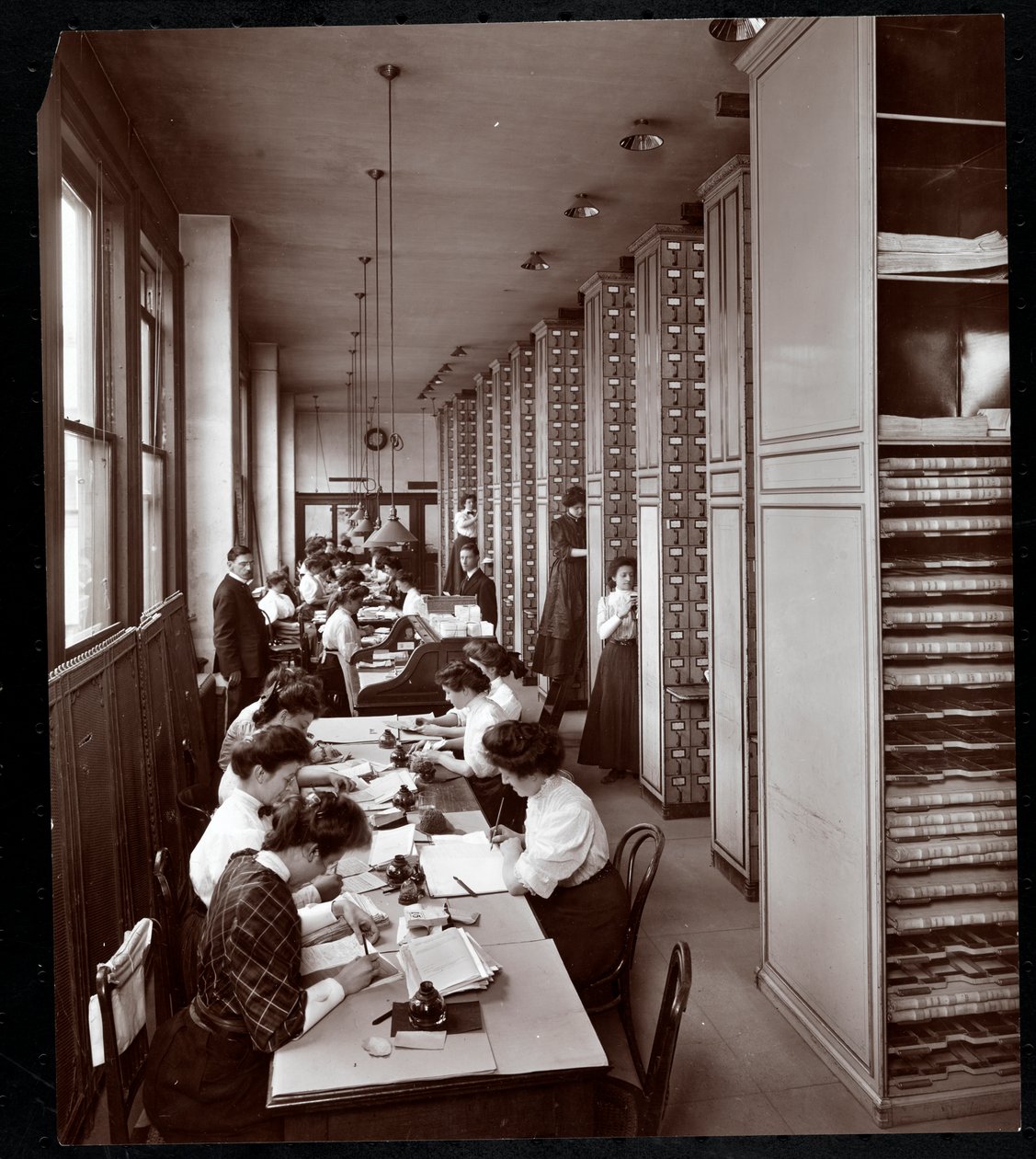 Women Working in a Filing Room, Under Male Supervision, at the Metropolitan Life Insurance Co. at 23rd Street and Madison Avenue, New York by Byron Company