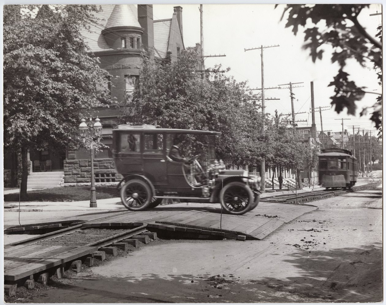 Packard Limousine Crossing the Streetcar Tracks at Lindell Boulevard and Boyle Avenue by Charles Clement Holt