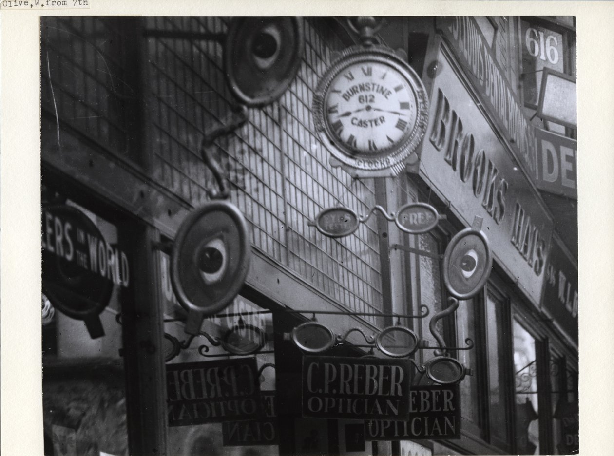 Signs for C.P. Reber Optician, Burnstine Caster Clocks, and Brooks Hats Along Their 612-614 Olive Street Store Fronts by Charles Clement Holt