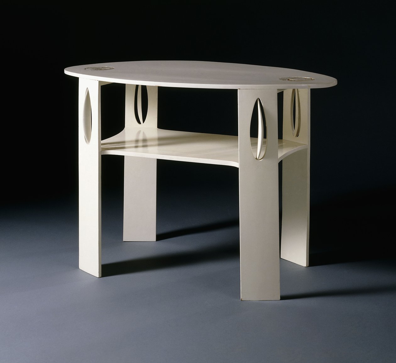 A white oval side table, originally designed for 14 Kingsborough Gardens, Glasgow by Charles Rennie Mackintosh