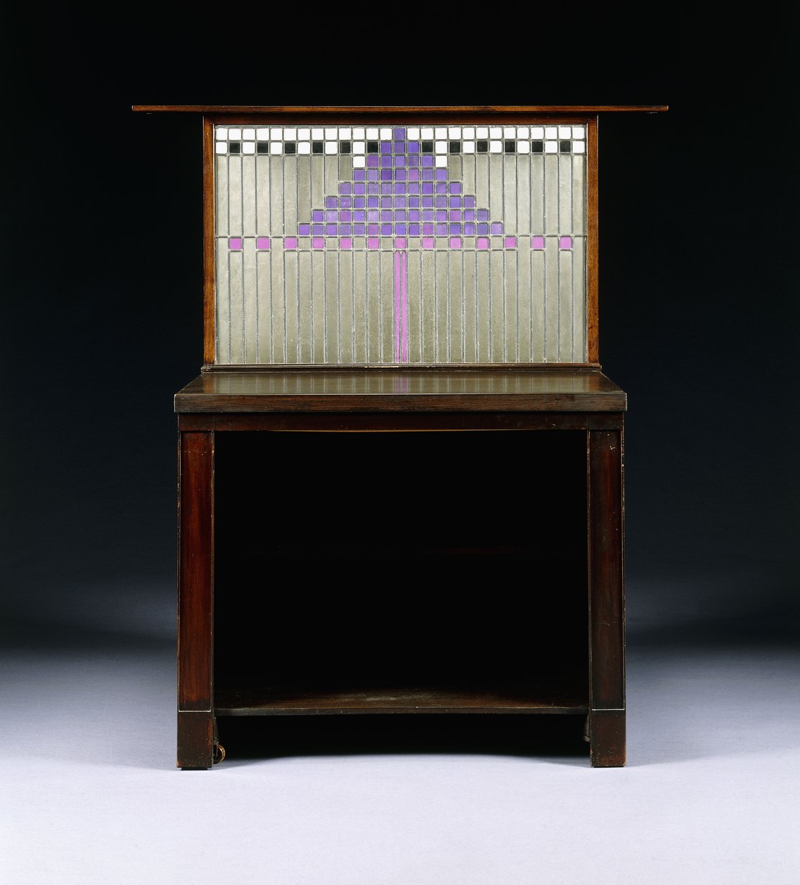 A writing cabinet designed for Walter W. Blackie Esq., Hill House, Edinburgh by Charles Rennie Mackintosh