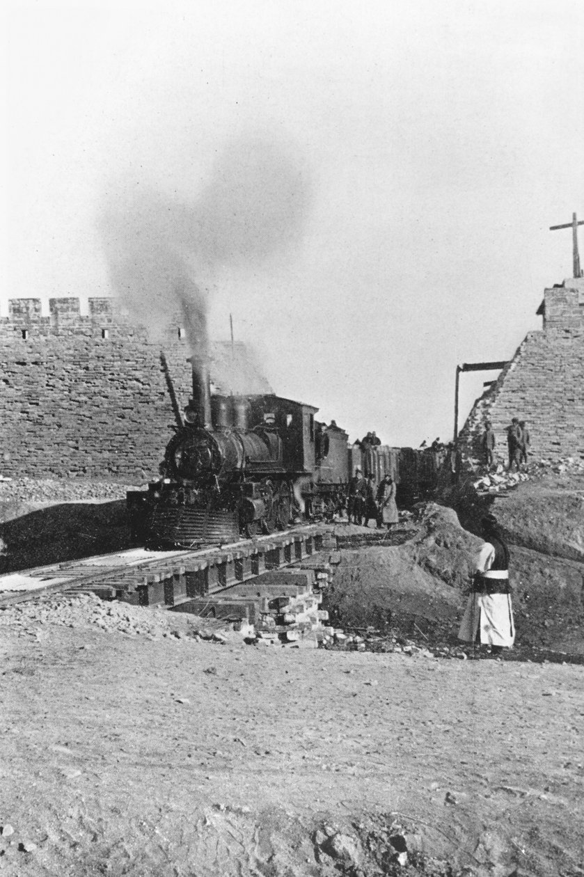 First train passing through the wall of Peking, China, c.1900 by Chinese Photographer
