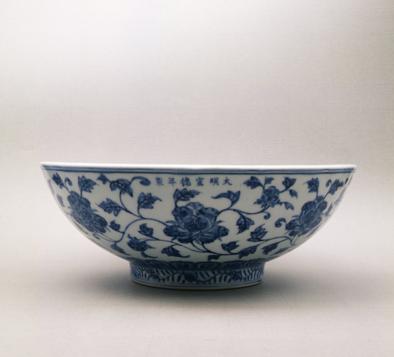 Blue and white bowl with floral decoration bearing the reign mark of Hsuan Te, 1426-35, Ming Dynasty by Chinese School
