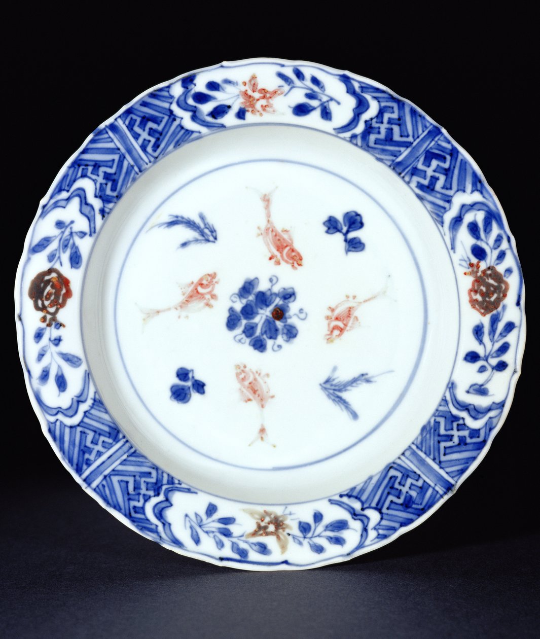 Plate decorated in underglaze blue with touches of copper red, late Ming dynasty, c.1630 by Chinese School