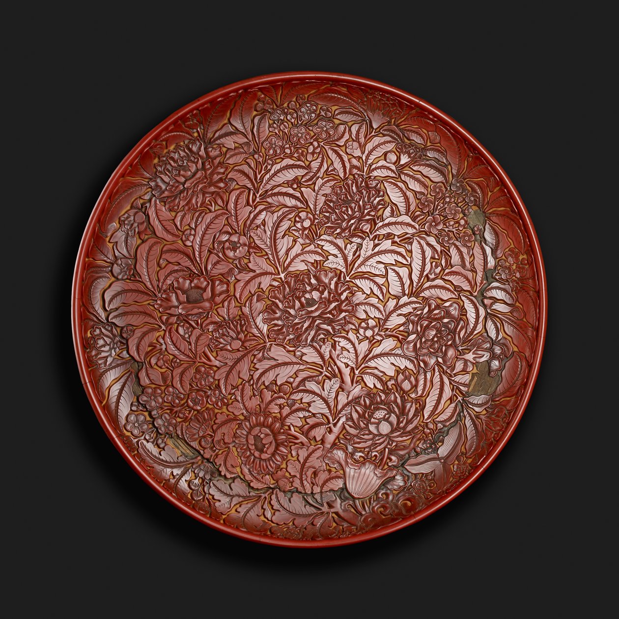 Carved dish bearing the mark of Xuande (1426-36) in the base, Chinese by Chinese School