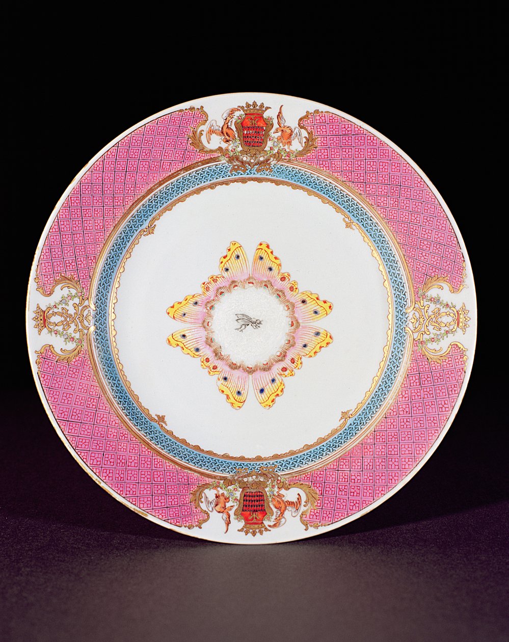 Dinner plate painted in Famille Rose enamels with the arms of the ...