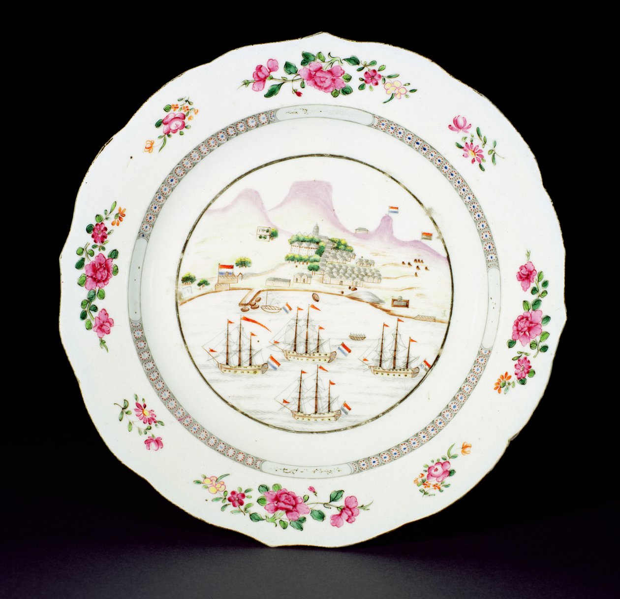 Dinner plate painted in famille rose enamels showing Table Mountain and four ships flying the Dutch flag off the Cape of Good Hope, Qianlong period c.1770 by Chinese School