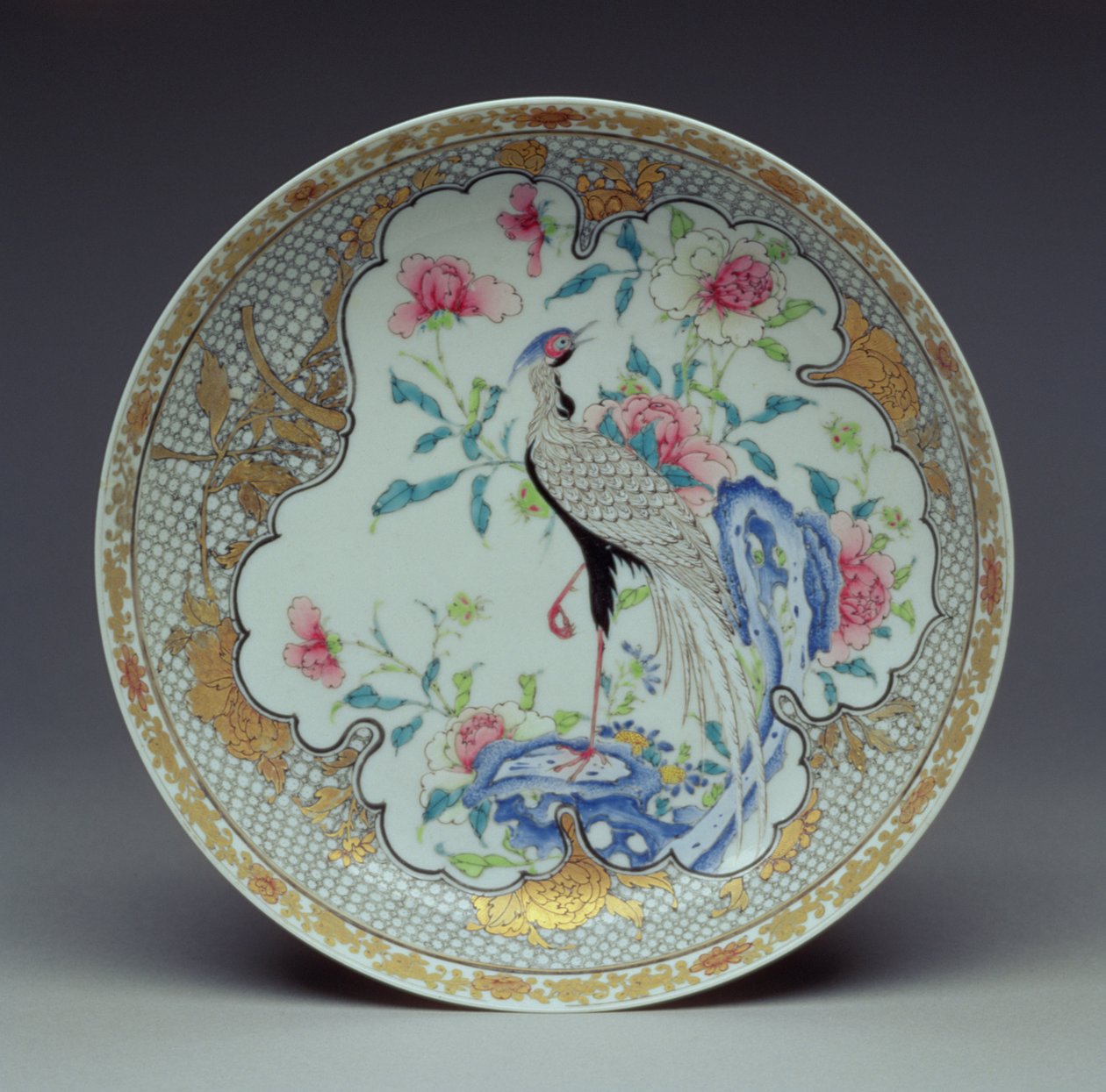 Dish painted with a long-tailed bird, rocks and flowers, Yongzheng Period, 1725-35 by Chinese School