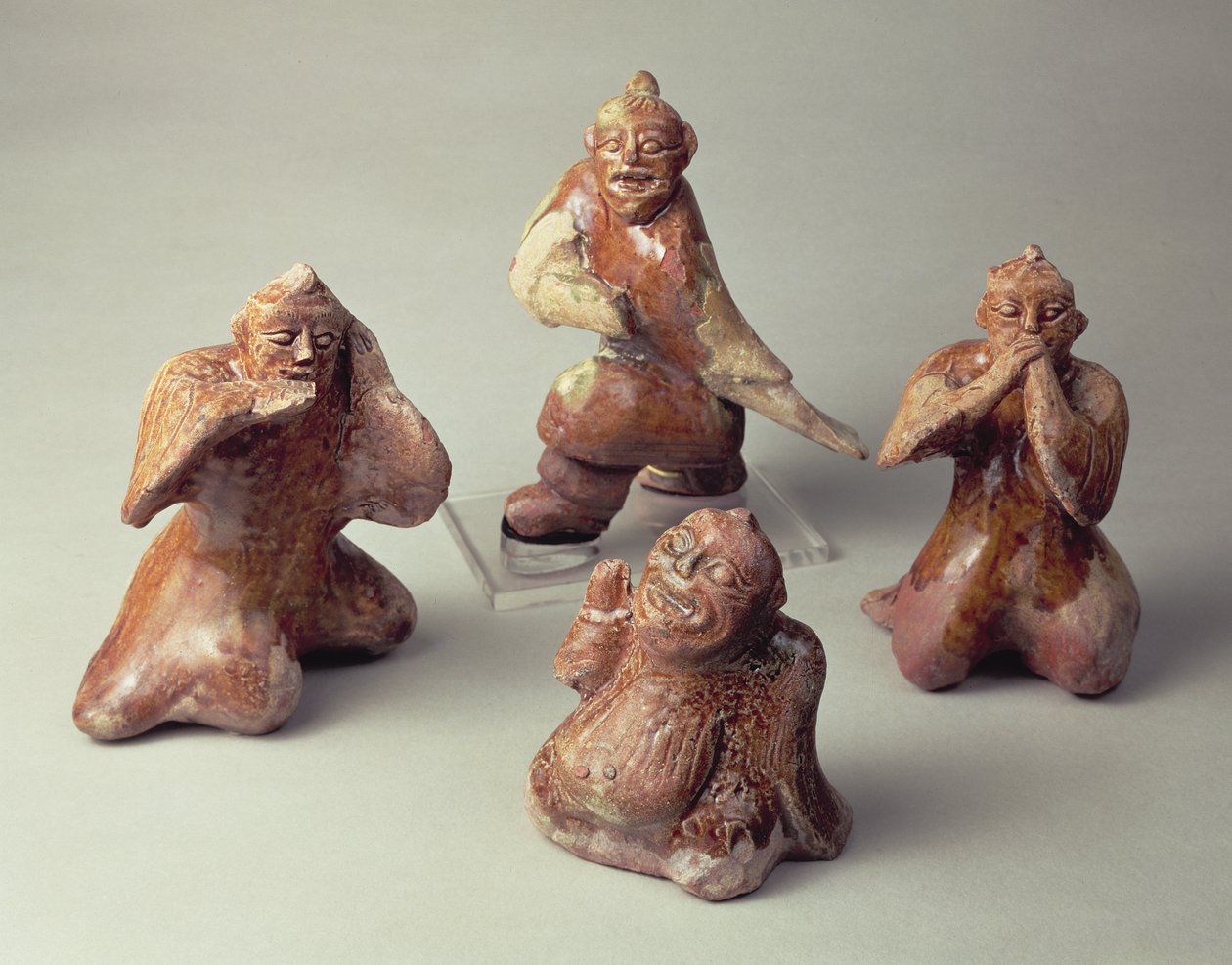 Early Chinese pottery group of four entertainers, tomb artefact, Han Dynasty, 25-220 AD by Chinese School