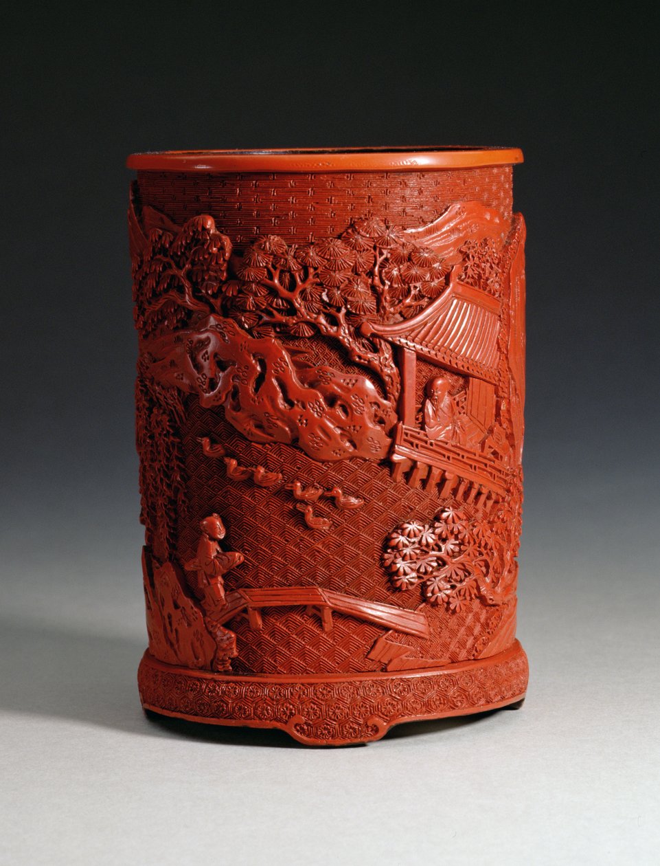Red moulded brushpot depicting the famous calligrapher Wang Hsi-chih sitting in his pavilion retreat by Chinese School