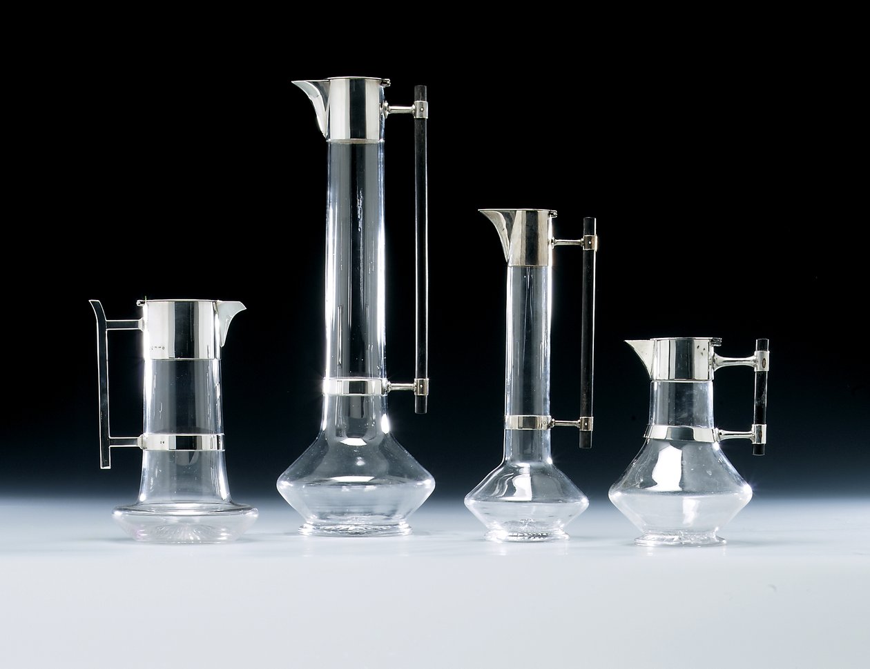 A Silver-Mounted Claret Jug and Other Glassware by Christopher (attr. to) Dresser