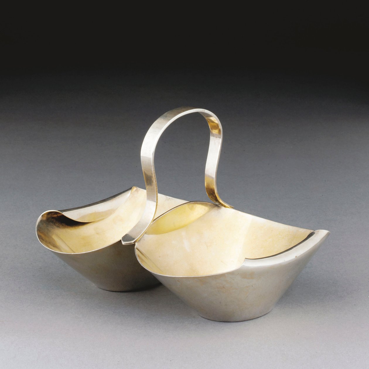 A White Metal Basket by Christopher Dresser
