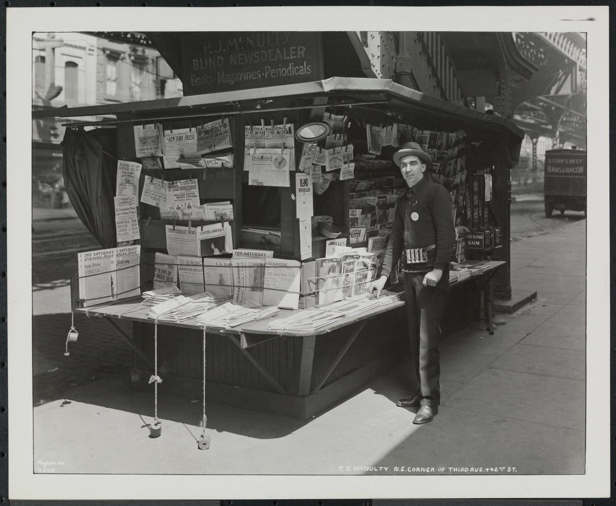 Blind news dealer, P.J. McNulty at his stand at the north east corner of 3rd Avenue & 42nd Street by Company Byron