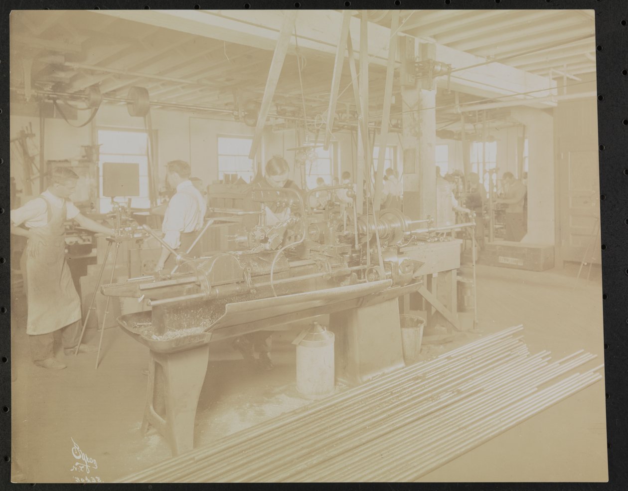 Dressler & Co. motion picture laboratory with men working by Company Byron