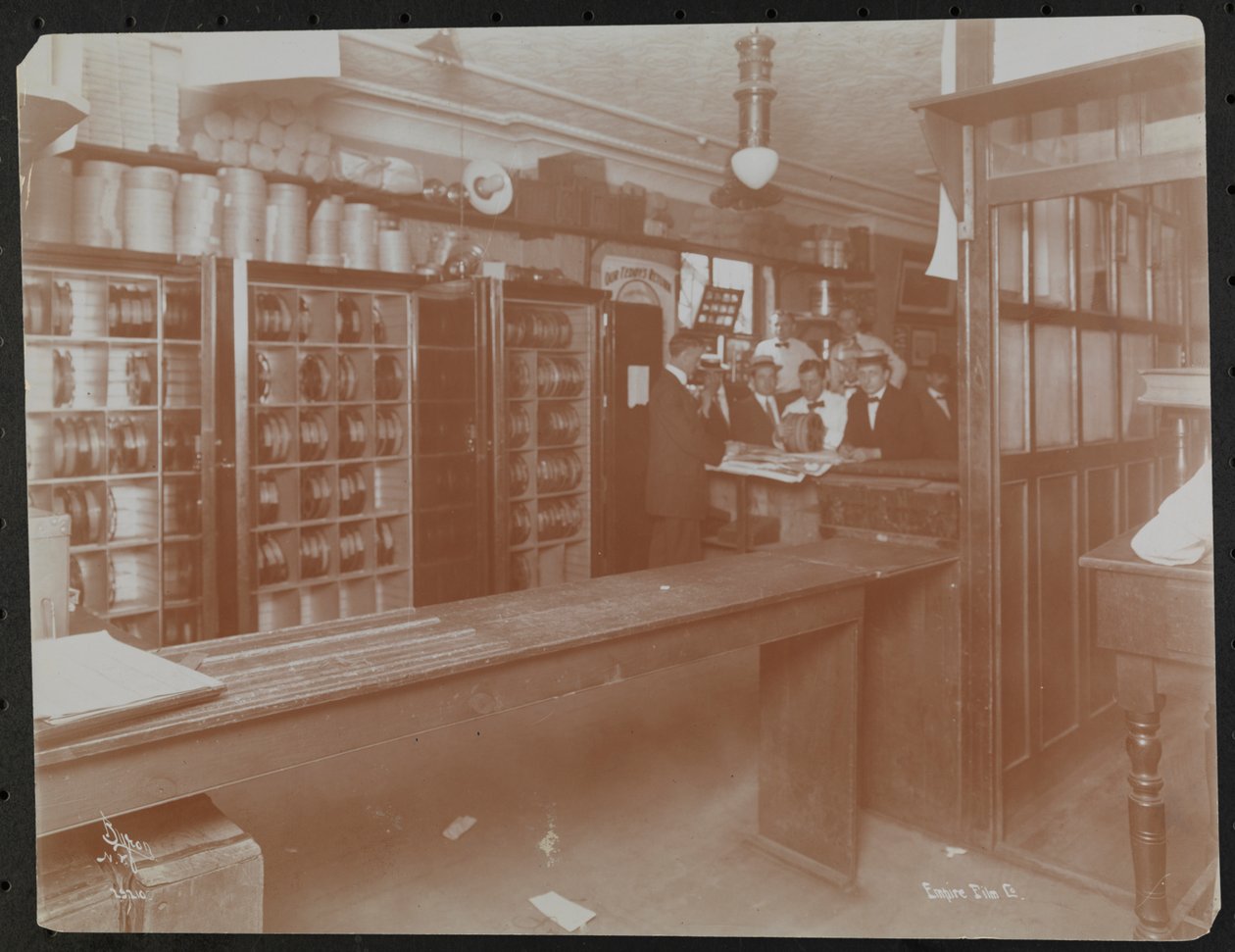 Retail area at the Empire Film Co (possibly at Broadway and 55th Street) with canisters of film, New York by Company Byron