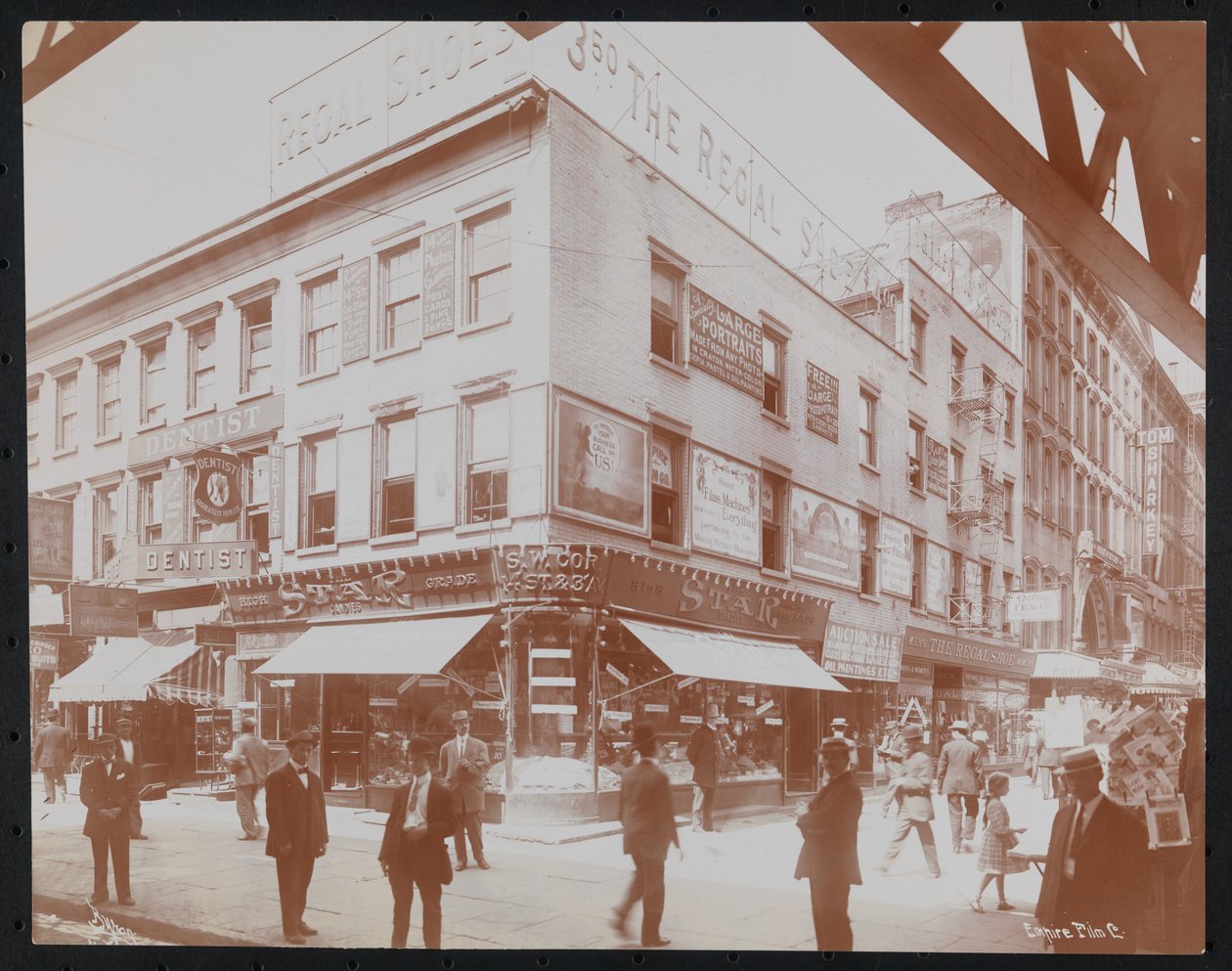 South-West Corner of 14th Street and 3rd Avenue Showing the Star Candies Store, a Dentist, the Regal Shoe Store and the Empire Film Co., c.1905 by Company Byron