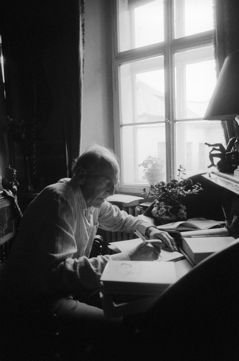 Jiri Mucha Sitting at His Desk in His House in Hradcany, Prague by Czech Photographer