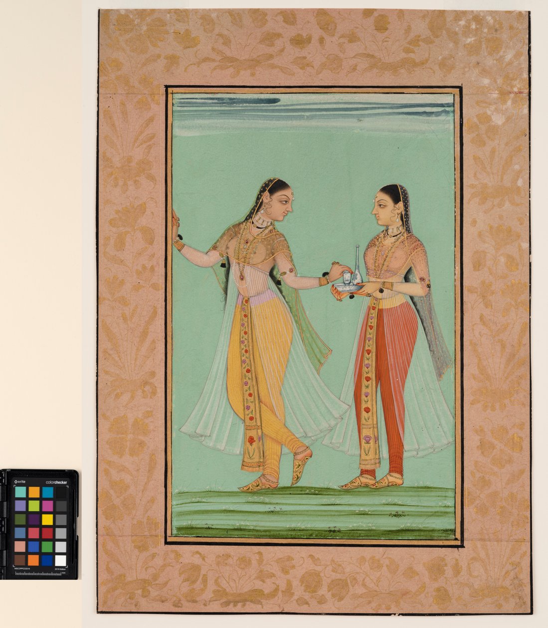 A standing lady offered a tray by her maid, c.1670 by Deccani School