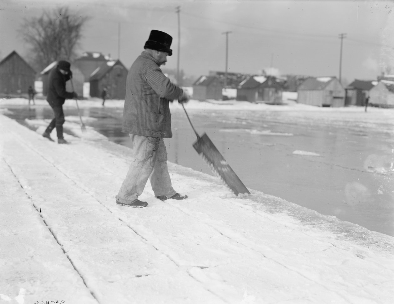 Ice harvesting, sawing, c.1900-10 by Detroit Publishing Co.