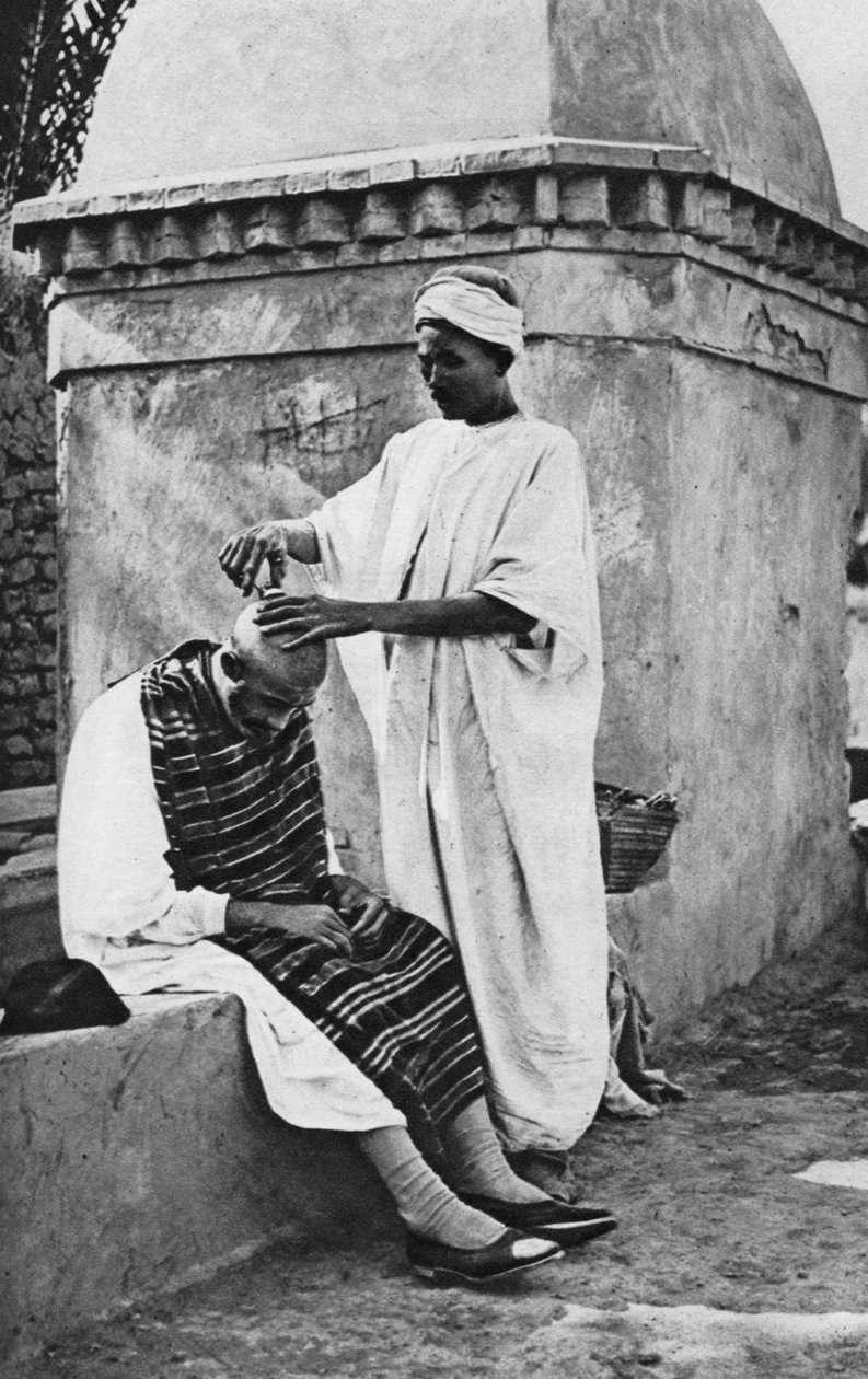 A street barber and his client, Algeria, Africa, 1922 by Donald McLeish