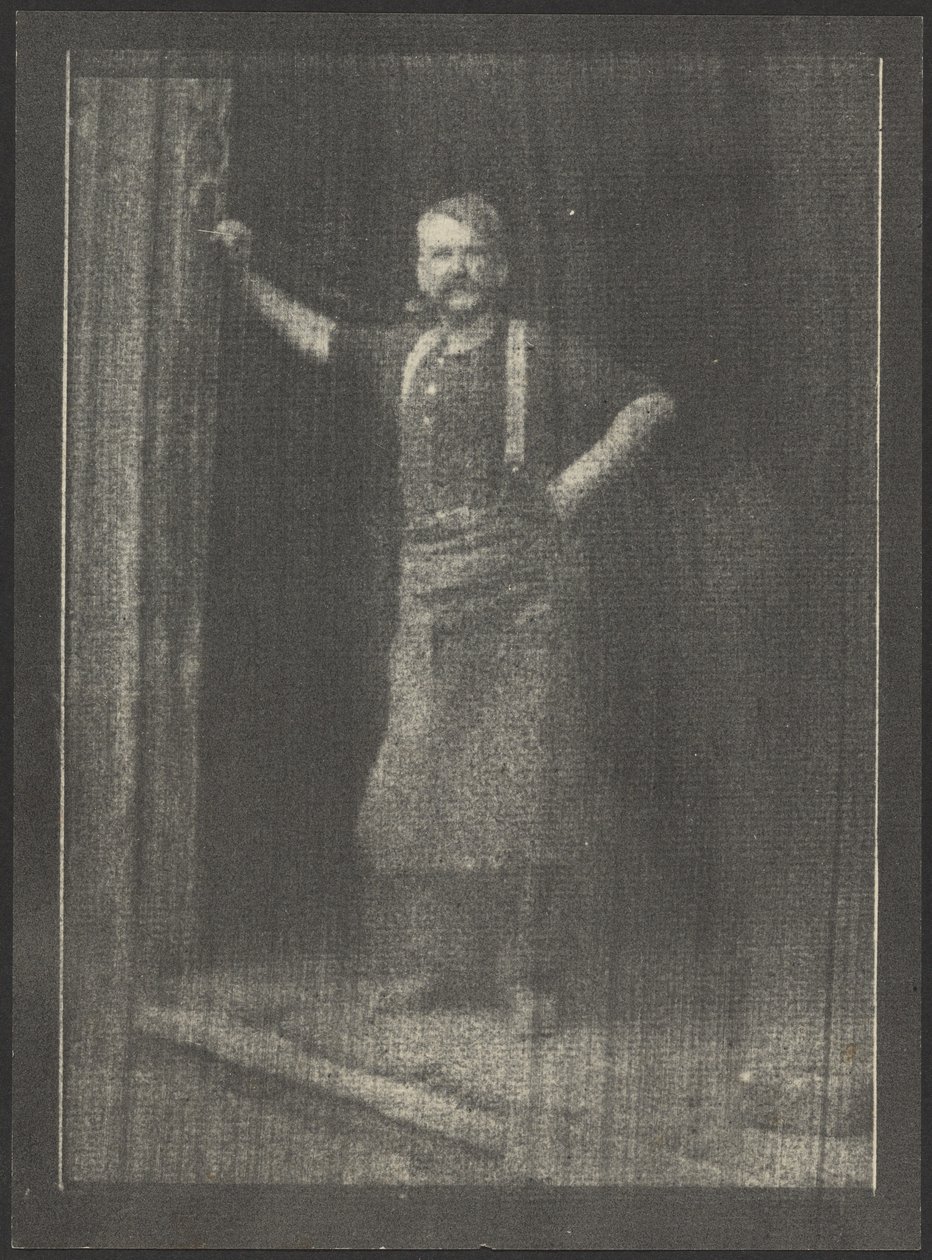 Blacksmith Standing in Doorway, Pipe in Mouth by Doris Ulmann