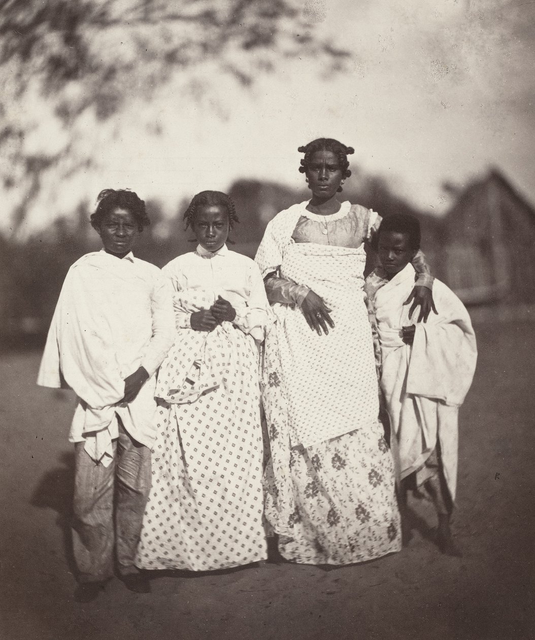 Madagascan Woman and Her Children (Plate 3) by Désiré Charnay