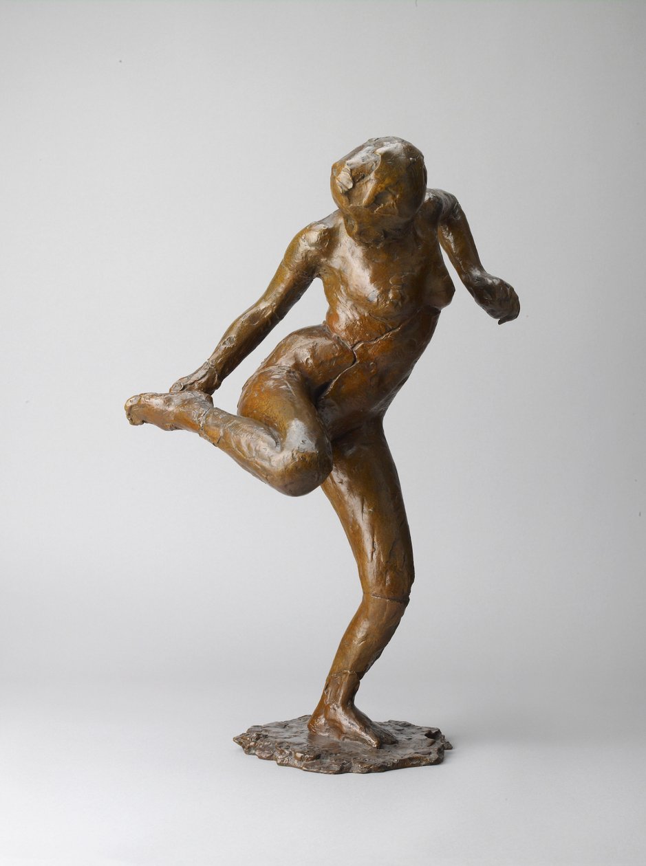 Dancer looking at the sole of her right foot by Edgar Degas