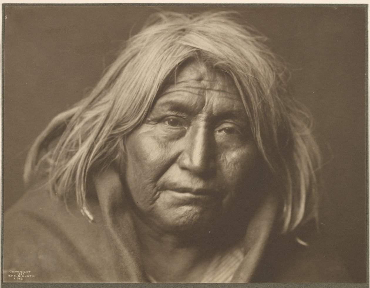 [An Apache] by Edward S. Curtis