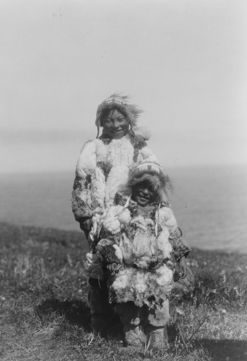 A young child and an older Eskimo wearing duck skin parkas, Nunivak Island, Alaska, c.1929 by Edward Sheriff Curtis
