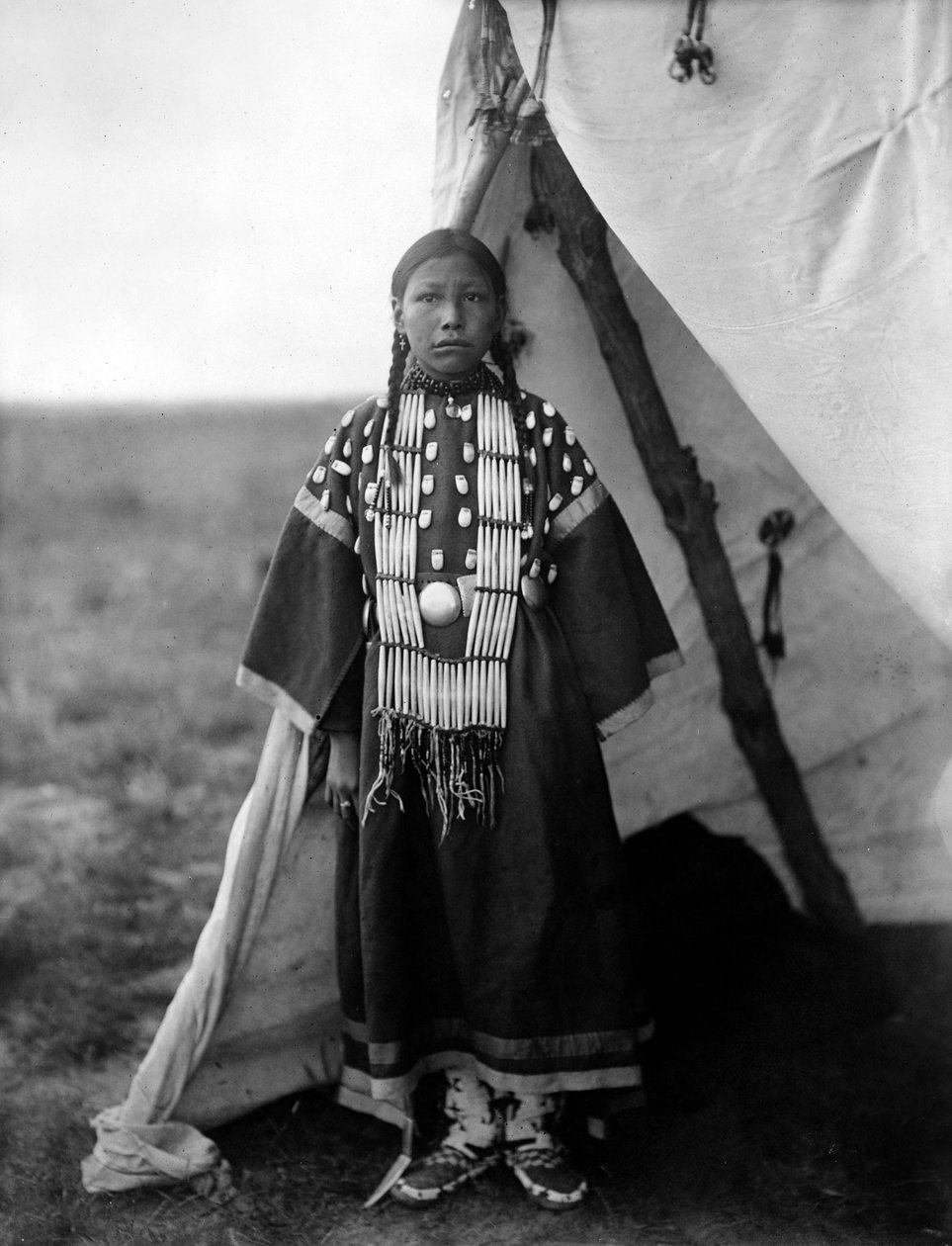 Rosa Lame Dog, Dakota Woman Standing at Doorway of Tipi, c. 1905 by Edward Sheriff Curtis