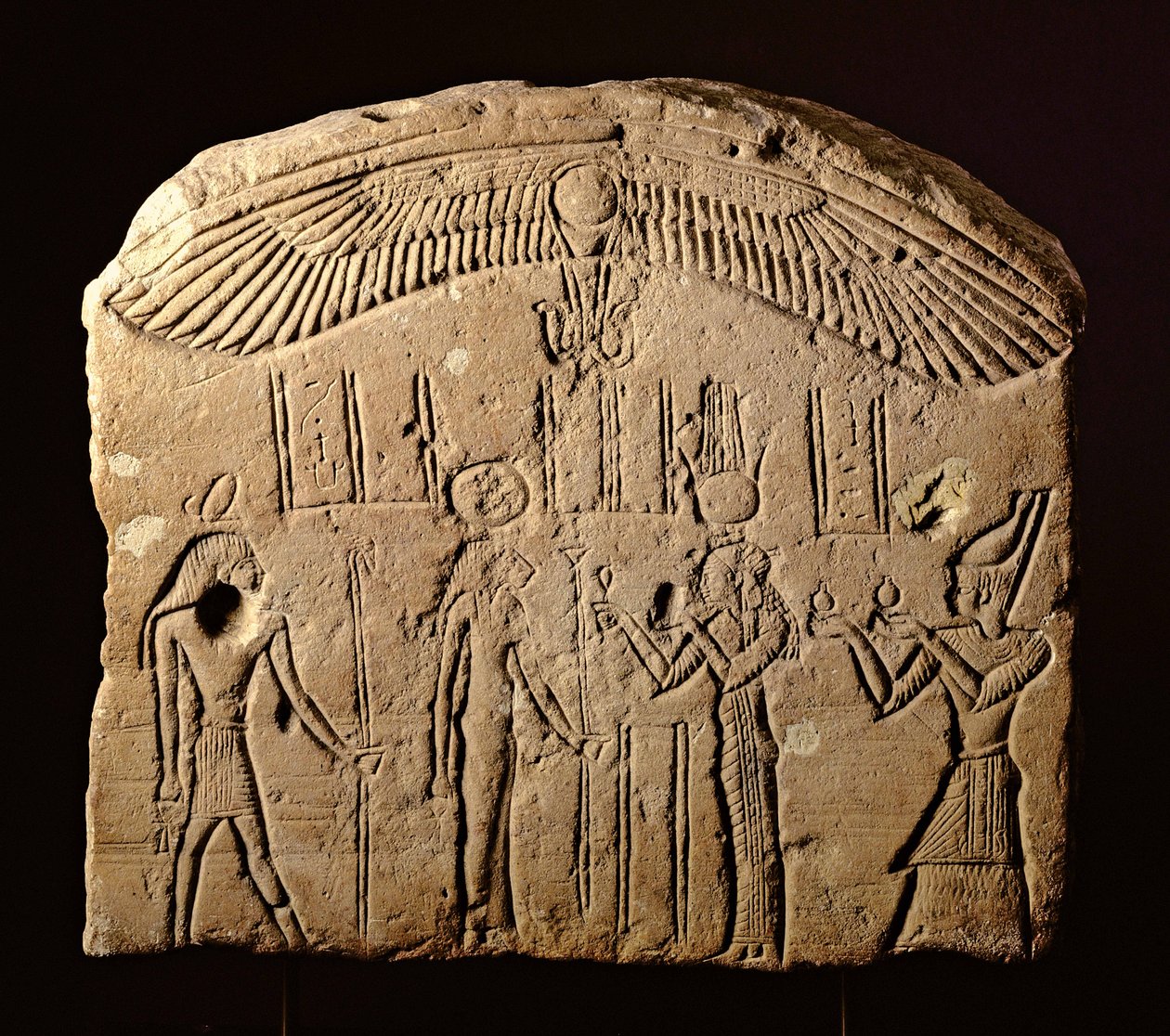 Bas relief stele with an offering scene, a Pharaoh with the goddess Sekhmet and the god Heka by Egyptian Ptolemaic Period