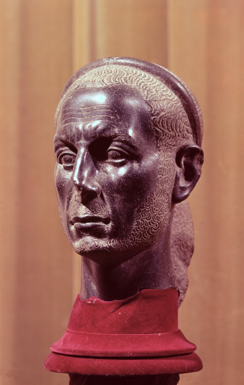 Head of a statue of a bearded priest with a starred diadem, thought to be a portrait bust of Julius Caesar (c.100-44 BC), Egyptian, from the Nile Delta by Egyptian School